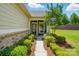 Inviting home entrance with lush landscaping and a charming walkway leading to the front door at 258 Cherrytree Dr, Fort Mill, SC 29715