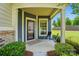 Cozy front porch with seating area, perfect for enjoying the outdoors with landscaped garden at 258 Cherrytree Dr, Fort Mill, SC 29715