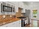 Updated kitchen with stainless steel appliances, granite countertops, and ample cabinet space at 258 Cherrytree Dr, Fort Mill, SC 29715