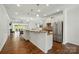 Modern kitchen with stainless steel appliances, granite countertops, and open layout to dining area at 258 Cherrytree Dr, Fort Mill, SC 29715