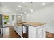 Open kitchen featuring a large island with a sink and stainless steel appliances at 258 Cherrytree Dr, Fort Mill, SC 29715