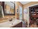 Bathroom featuring a large mirror, granite countertops, stone backsplash and a closet for lots of storage at 2843 Startown Rd, Lincolnton, NC 28092