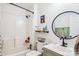 Well-lit bathroom features a shower-tub combination, updated sink and vanity, plus stylish decor at 2843 Startown Rd, Lincolnton, NC 28092