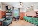 Charming bedroom with a ceiling fan, large window, and custom shelving at 2843 Startown Rd, Lincolnton, NC 28092