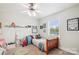 Charming bedroom with a wood bed frame, ceiling fan and a cozy rug at 2843 Startown Rd, Lincolnton, NC 28092
