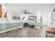Finished basement featuring vinyl floors, a modern ceiling fan, fun decor, and comfortable chair at 2843 Startown Rd, Lincolnton, NC 28092