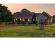Charming brick and stone home featuring a covered porch and beautifully landscaped front yard at 2843 Startown Rd, Lincolnton, NC 28092