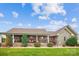 Charming brick home with stone accents, covered front porch and beautifully landscaped front yard at 2843 Startown Rd, Lincolnton, NC 28092