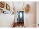 Cozy hallway features wood flooring, elegant front door, and decorative wall accents at 2843 Startown Rd, Lincolnton, NC 28092