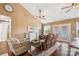 Cozy living area with vaulted ceiling, ceiling fan, wood floors, and natural light through sliding glass doors at 2843 Startown Rd, Lincolnton, NC 28092