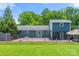 The fenced backyard showcases a spacious patio and a glimpse of the lush landscaping, perfect for outdoor living and relaxation at 2908 Dylan Nw Pl, Concord, NC 28027