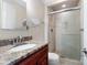 Bathroom featuring a glass shower and granite countertop at 2908 Dylan Nw Pl, Concord, NC 28027