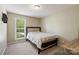 Bedroom features natural light and neutral colored walls at 2908 Dylan Nw Pl, Concord, NC 28027