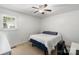 Neutral bedroom featuring large windows and a ceiling fan at 2908 Dylan Nw Pl, Concord, NC 28027