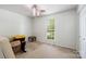 Bright bedroom featuring a window and ceiling fan at 2908 Dylan Nw Pl, Concord, NC 28027