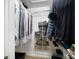 Walk-in closet with ample shelving for optimal storage at 2908 Dylan Nw Pl, Concord, NC 28027