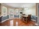 Bright dining area features hardwood floors and a view of the backyard pool at 2908 Dylan Nw Pl, Concord, NC 28027