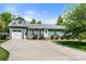 Inviting home exterior featuring a dormer window, attached garage and a well-kept front lawn at 2908 Dylan Nw Pl, Concord, NC 28027