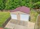 An aerial view of a detached garage shows a two-car garage and large driveway in a private, fenced yard at 2908 Dylan Nw Pl, Concord, NC 28027