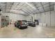 Spacious garage interior featuring ample storage and parking space, perfect for car enthusiasts or hobbyists at 2908 Dylan Nw Pl, Concord, NC 28027