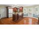Bright kitchen with hardwood floors, granite countertops and stainless steel appliances at 2908 Dylan Nw Pl, Concord, NC 28027