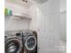 Bright laundry room with a washer and dryer at 2908 Dylan Nw Pl, Concord, NC 28027