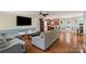 Open concept living room with hardwood floors, recessed lighting and view to the kitchen at 2908 Dylan Nw Pl, Concord, NC 28027