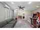 Well-lit living room with hardwood floors and comfortable sofa at 2908 Dylan Nw Pl, Concord, NC 28027