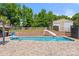 Inviting pool area with surrounding brick patio at 2908 Dylan Nw Pl, Concord, NC 28027