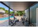 Poolside lounge area featuring a pergola at 2908 Dylan Nw Pl, Concord, NC 28027