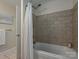 Modern bathroom showcasing a tiled shower over tub and neutral color palette at 300 W 5Th St # 723, Charlotte, NC 28202