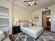 This bedroom features stylish decor, a plush rug, and access to an en-suite bathroom at 300 W 5Th St # 723, Charlotte, NC 28202