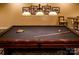 Well-appointed billiards table ready for a game of pool at 300 W 5Th St # 723, Charlotte, NC 28202