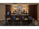 A stylish coffee bar features seating for four and beverage preparation area at 300 W 5Th St # 723, Charlotte, NC 28202