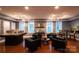 A community room with multiple seating arrangements and natural light at 300 W 5Th St # 723, Charlotte, NC 28202