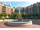 Beautiful building exterior showcasing a relaxing water fountain and lush green landscaping at 300 W 5Th St # 723, Charlotte, NC 28202