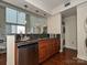Well-equipped kitchen with stainless steel appliances and wood cabinets at 300 W 5Th St # 723, Charlotte, NC 28202