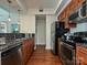 This stylish kitchen features stainless steel appliances and beautiful wood floors at 300 W 5Th St # 723, Charlotte, NC 28202