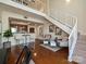 Open-concept living space with modern kitchen and beautiful wood floors at 300 W 5Th St # 723, Charlotte, NC 28202