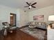 Cozy living room features stylish seating, modern lighting, and access to the bathroom at 300 W 5Th St # 723, Charlotte, NC 28202