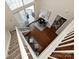 Sunlit loft features hardwood flooring, a balcony, and a cozy work nook at 300 W 5Th St # 723, Charlotte, NC 28202