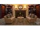 An inviting lounge area with comfortable seating and a cozy fireplace feature at 300 W 5Th St # 723, Charlotte, NC 28202
