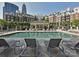Relaxing pool area featuring comfortable lounge chairs and a covered pavilion in front of the building at 300 W 5Th St # 723, Charlotte, NC 28202