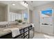 Bright bathroom features dual sinks, granite counters, and two windows at 3092 Riker St, Clover, SC 29710