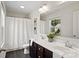Bright bathroom featuring double sinks, dark wood cabinets, and modern fixtures at 3092 Riker St, Clover, SC 29710