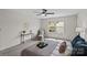 Neutral bedroom showcasing a cozy armchair, a window, and a plush, inviting bed at 3092 Riker St, Clover, SC 29710