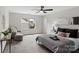 Bright bedroom features neutral decor, a ceiling fan, and natural light from a window at 3092 Riker St, Clover, SC 29710