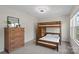 Comfortable bedroom with wooden bunk bed and dresser offering ample space and storage at 3092 Riker St, Clover, SC 29710