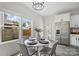 Bright dining area with modern table set, stainless steel refrigerator, and backyard view at 3092 Riker St, Clover, SC 29710