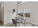 Cozy dining area featuring a round table, four chairs, and a modern light fixture at 3092 Riker St, Clover, SC 29710